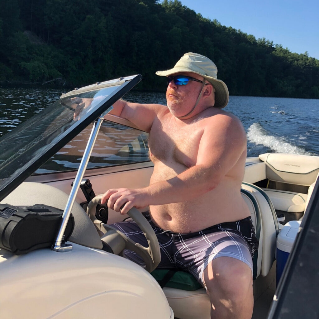 Todd Boynton Before weight loss shirtless on a boat