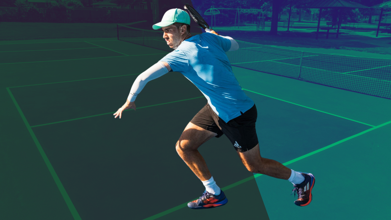 Federico Staksrud Pickleball Bag: Player wearing blue shirt and black shorts ready to hit a shot.