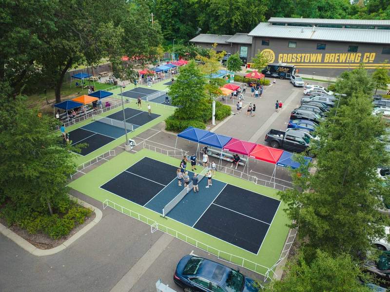 Pickleball Pop-ups setup at Crosstown brewing company in memphis. 4 pickleball courts in the parking lot.