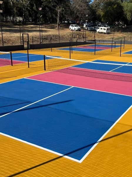 The yellow and blue courts at the German pickleball club in Johannesburg South Africa.