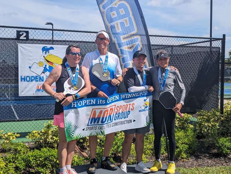 Pete Dellaluna, Kondor sponsored pickleball coach 2nd from the left, with three of his students.